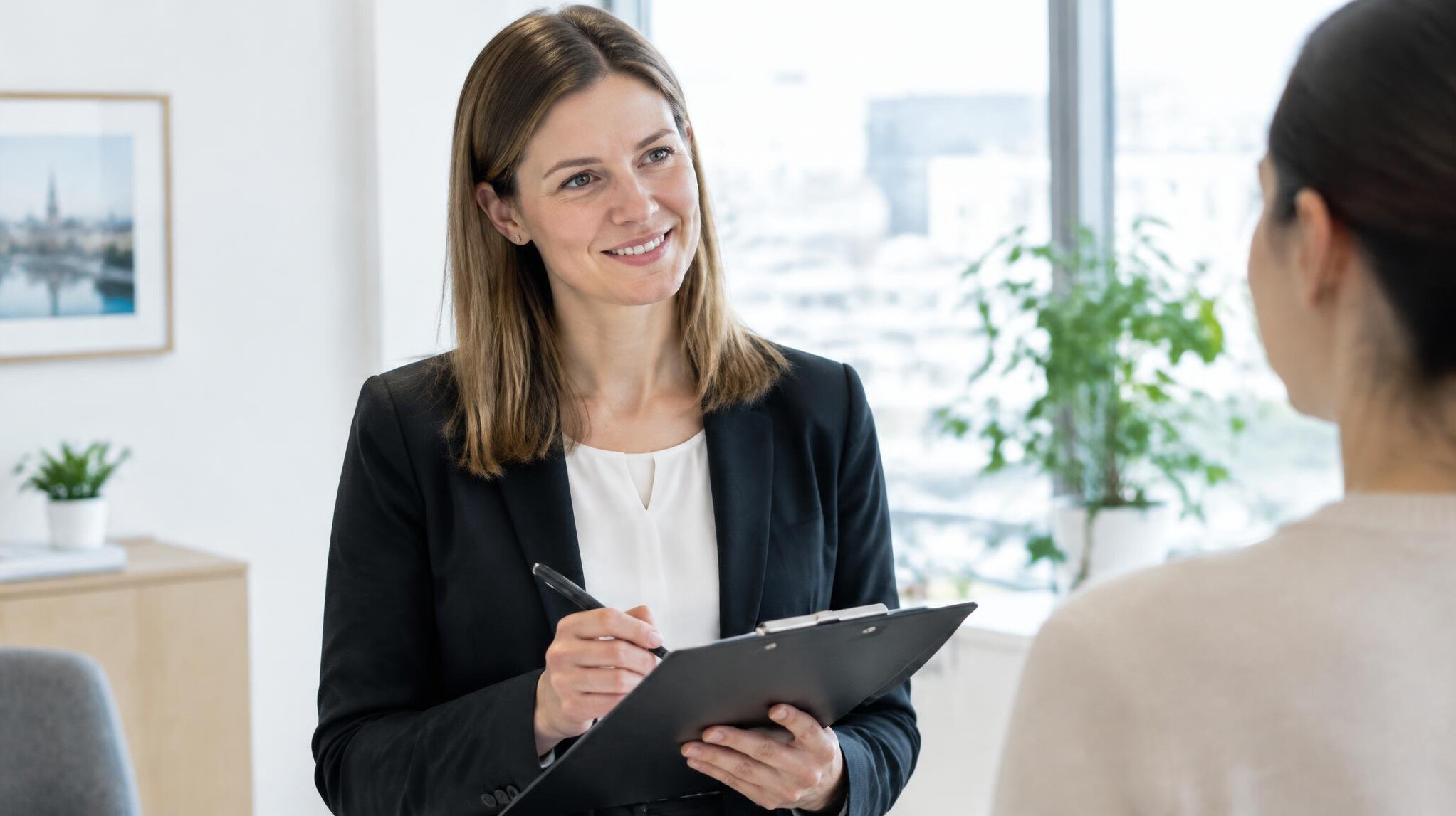 Researcher conducting a survey interview with a clipboard