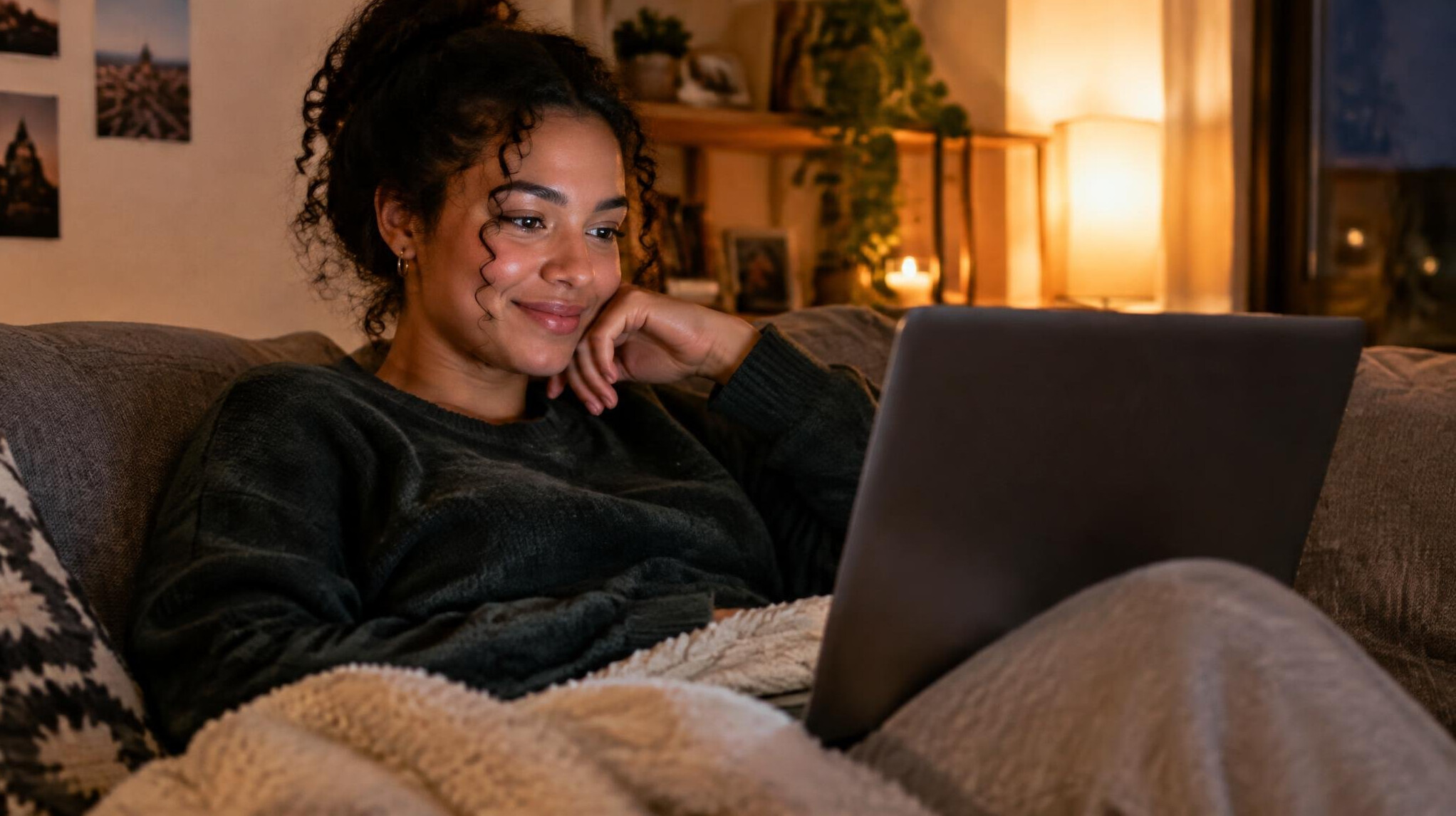 Person watching streaming content on a laptop at home